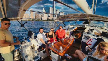 Sailing at the helm near the Statue Of Liberty