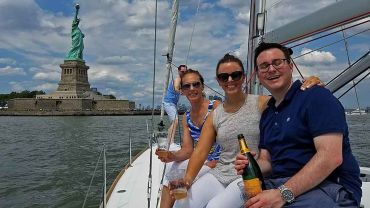Champagne on a sailboat at the Statue Of Liberty
